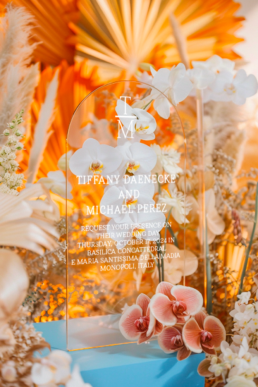 Elegant plaque and floral arrangement celebrating Tiffany Darenock and Michael Perezs special day.